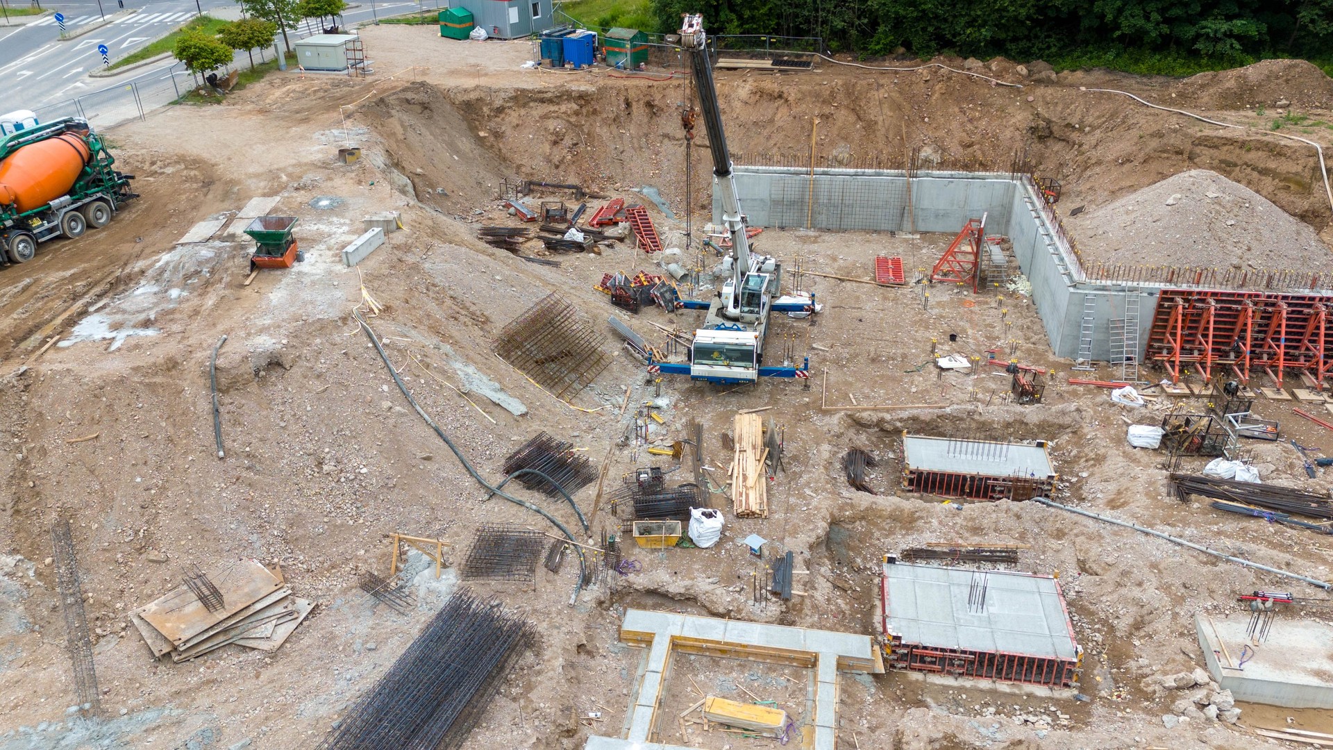 Drone photography of construction site , construction material and machinery during summer evening